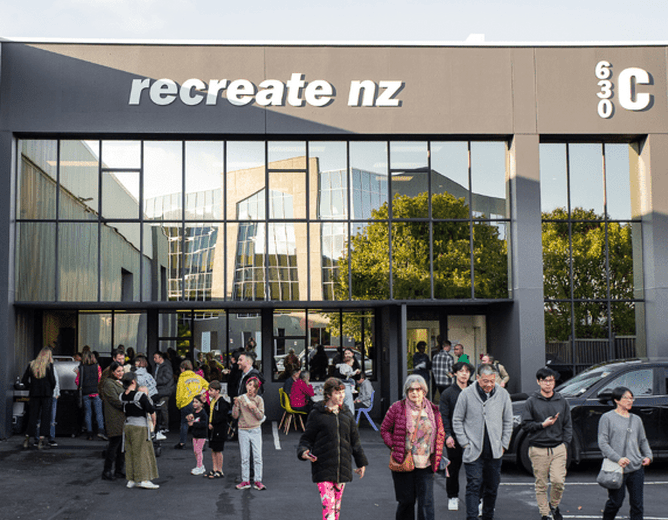 Image of the official opening of the of the new kitchen at Rcreate NZ. People milling outside the Recreate NZ building.
