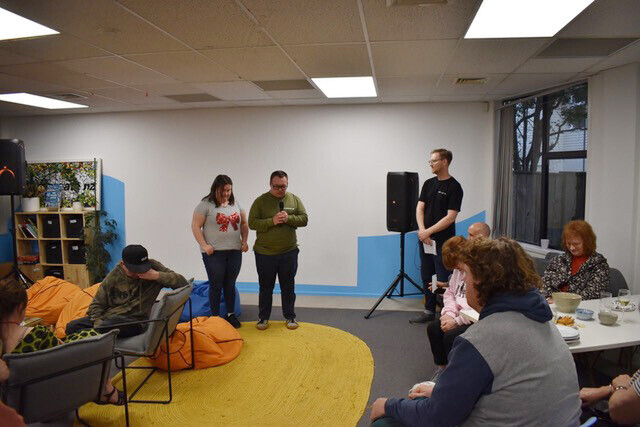 Image of the young people, families and supporters at the official opening of the new Recreate NZ kitchen.