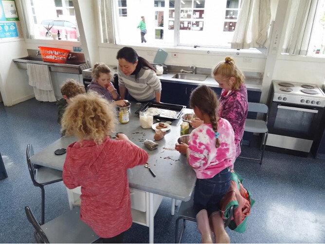 Image from Bountiful Backyards 2025, kids making bliss balls.