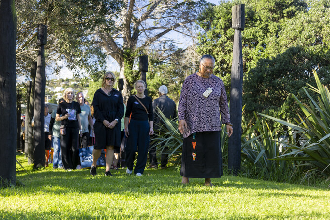 Local Waiheke Islanders, local charitable trust members and Save the Kiwi walk together carrying the Kiwi's in wooden boxes.