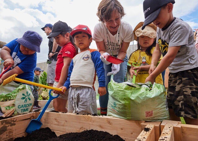 Image of young children gardening under the Garden To Table Programme. 