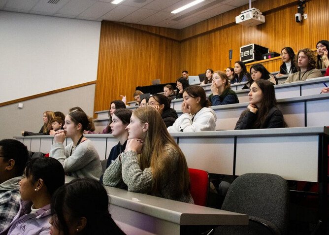 EnviroPAST: Plastic And Sustainability Talks, is a two-day conference funded by The Jenkins Foundation. New Zealand. Image of students listening to a talk by Professor Simon Kingham.