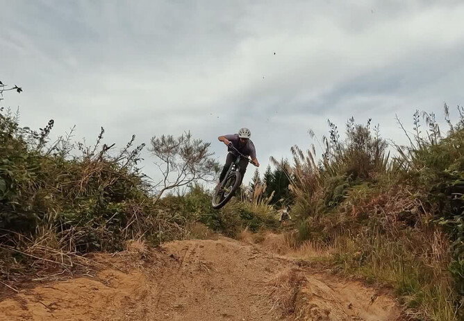 Matiu riding the jumps at the bottom of Crank