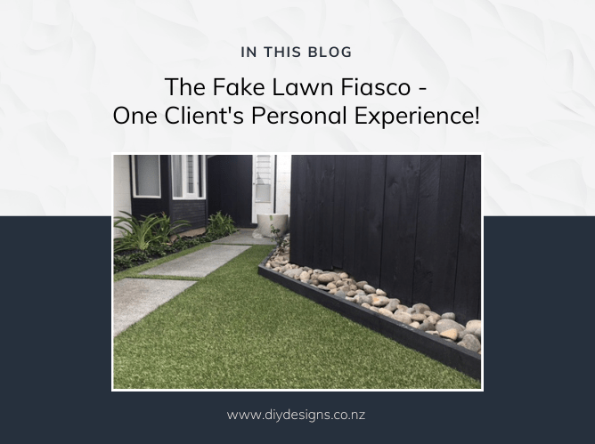 A nice tidy garden with artificial lawn and a concrete paver path. There's a house in the background and in the foreground, some riverstones in a narrow garden, with a black fence behind