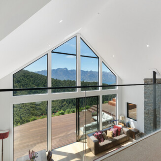 Looking down the side of the home exterior with board and batten cladding.
