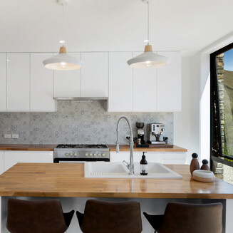 Looking out the front sliding door into the garden from the kitchen area.