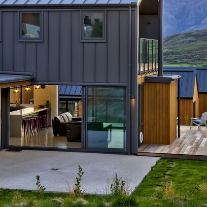 Two storied home in Jacks Point clad in alpine tray and cedar with a second story balcony area.