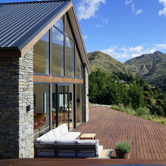 A light and bright kitchen with timber bench tops, and white cabinetry.