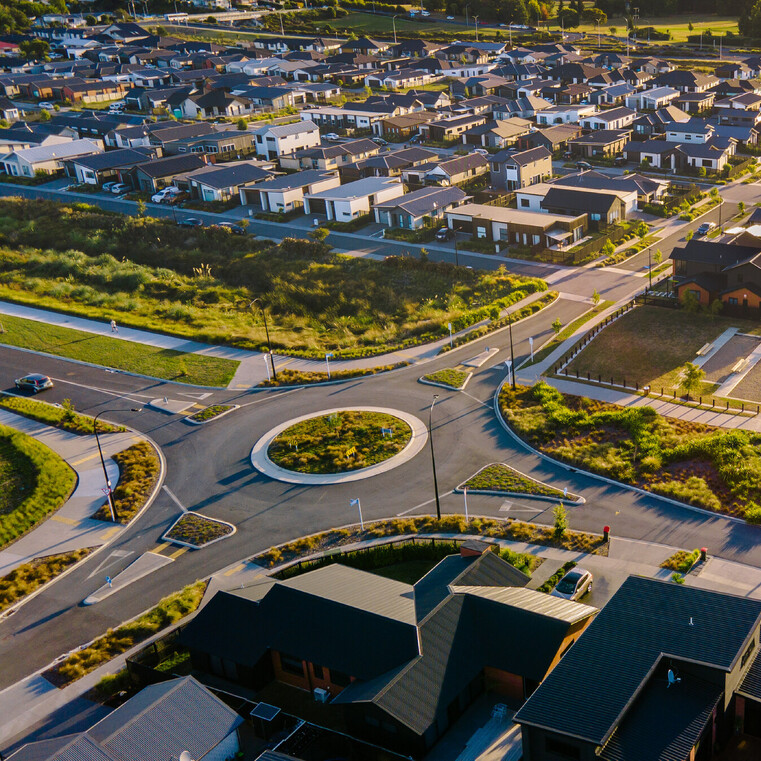 Drone shot of Roundabout with homes on the right side