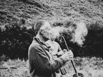 Shepherd smoking, black and white. Autumn Muster.  Lake Heron Station, Canterbury High Country, New Zealand
