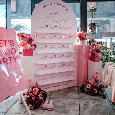 Winter wedding inspiration photo from Kumeu Valley Estate fireplace with flowers and curtain lights