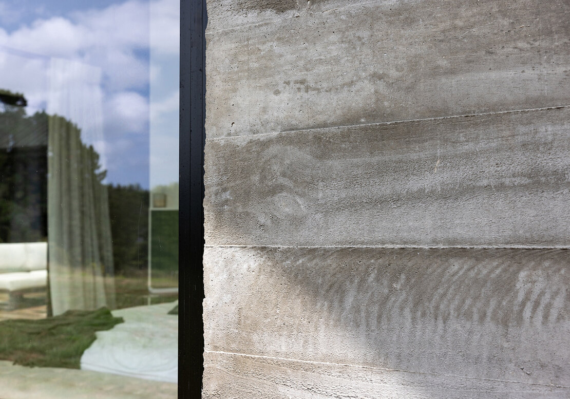 A close up of the concrete panel wood-grain effect that was made by Straight Up Builders Tauranga.