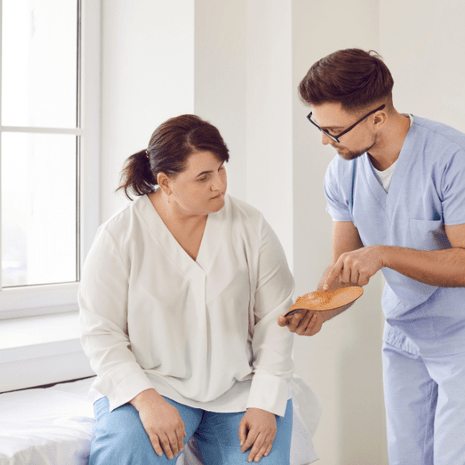 Podiatrist diagnosing and managing osteochondral ankle lesion with orthotics and rehabilitation at Foot Foundation