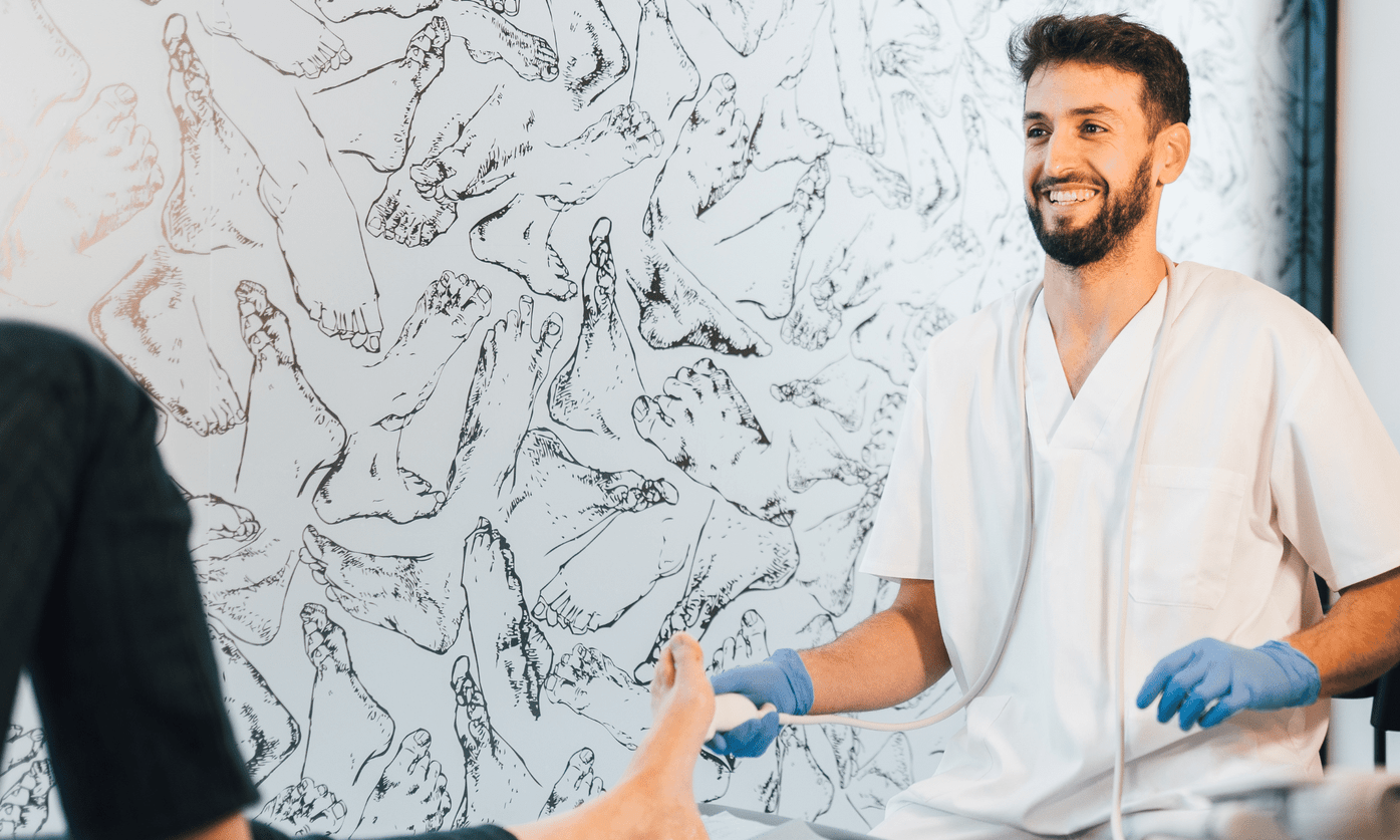 Podiatrist diagnosing and managing osteochondral ankle lesion with orthotics and rehabilitation at Foot Foundation