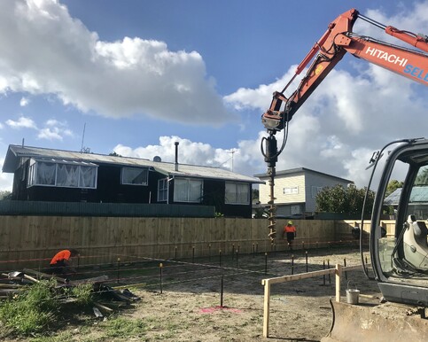 Drilling holes for the piles on the new site. Due to the location of the house being close to the beach it was very important to ensure solid foundations. 