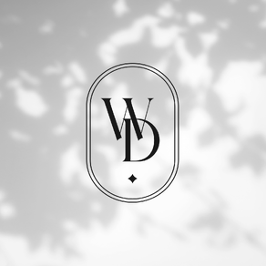 WD Wild Daisy Monogram over top of a leafy shadow wall.