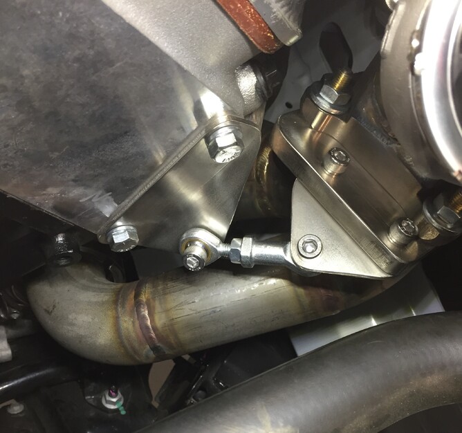 Another example of a rose joint type brace, this will take the weight of the turbo but still allow movement when the manifold expands and contracts