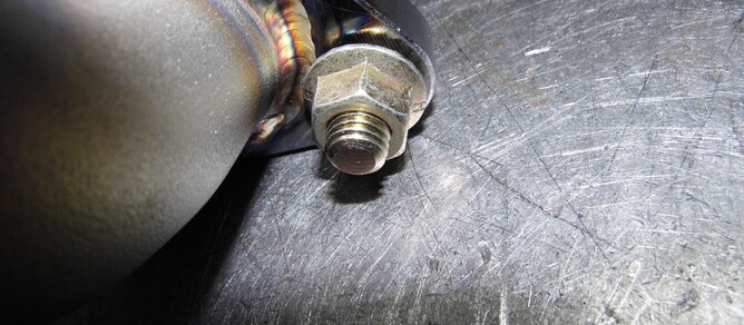 You can see in this photo the flange section is hitting the weld and is not pulling up on the manifold flange