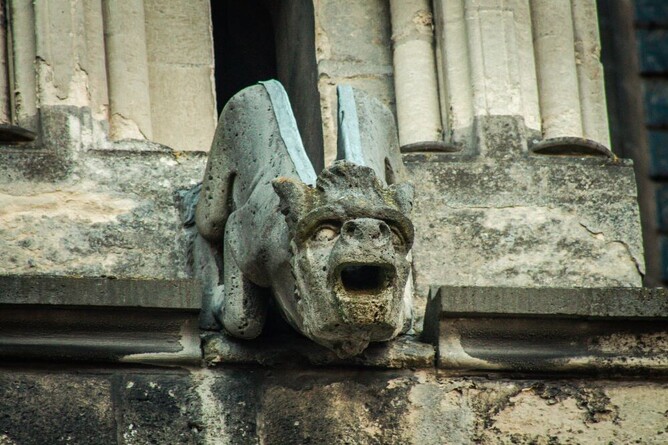 gargoyle for rainwater guttering on ancient rooftop 