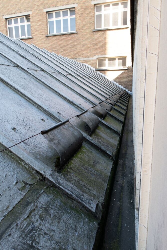 Old metal roof with ancient guttering