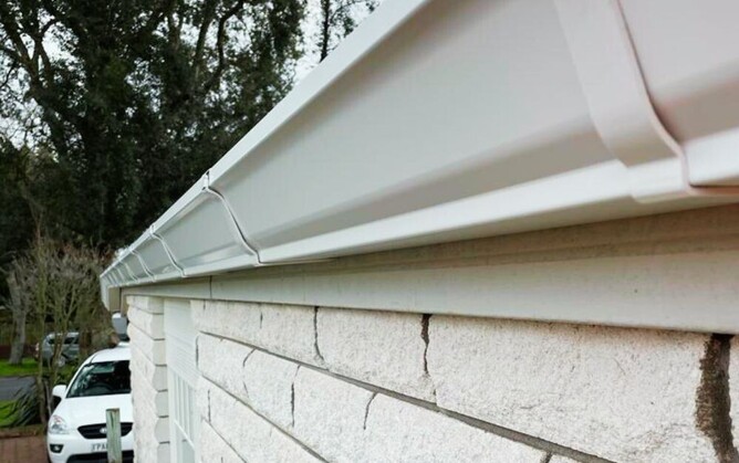 closeup of new white guttering