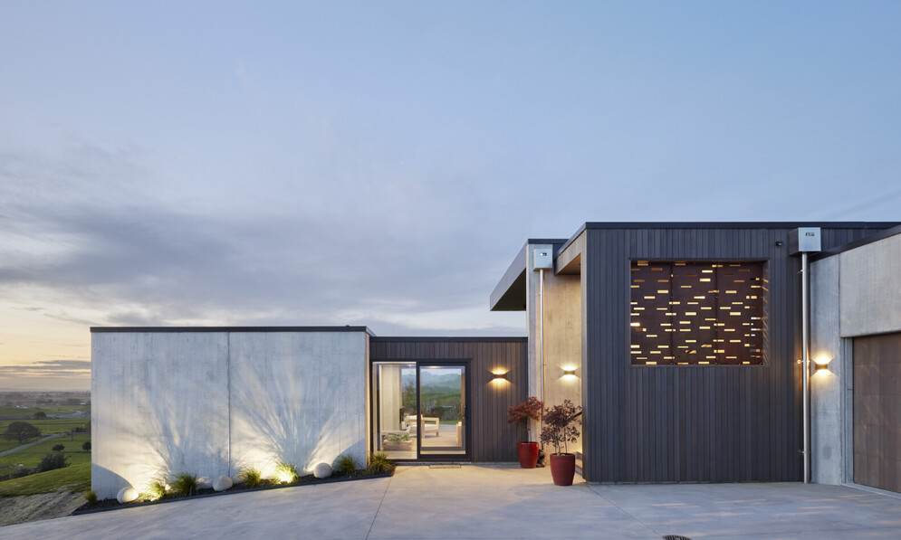 concrete and cedar house on hill
