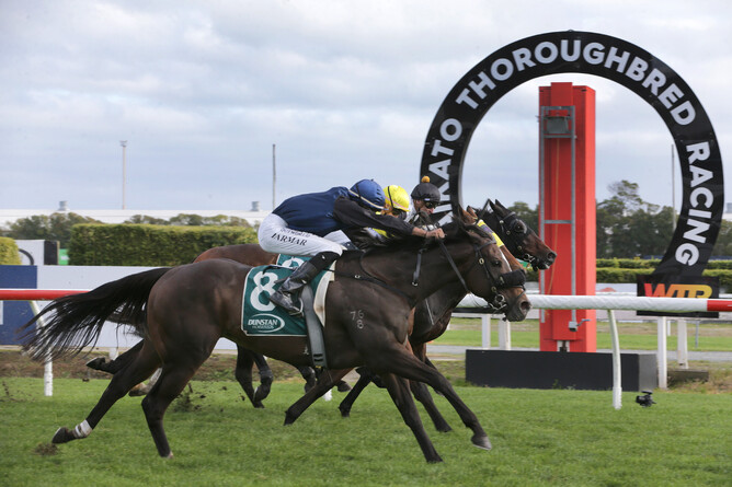 Aris Aris flashes down the outside to win the Dunstan Horsefeeds 1300 at Te Rapa on Saturday under Niranjan Parmar.   - Photo: Trish Dunell
