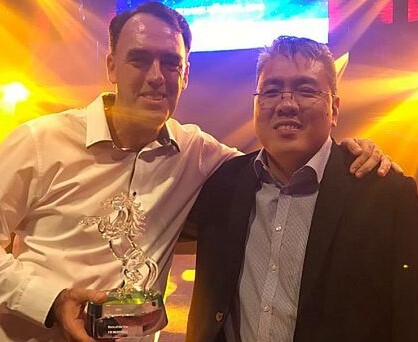 Trainer Shane Baertschiger and owner Desmond Ong of Doha Stable celebrate I’m Incredible’s award  - Photo: Singapore Turf Club