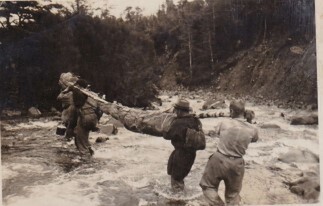 (Rescue crew carrying bodies out)