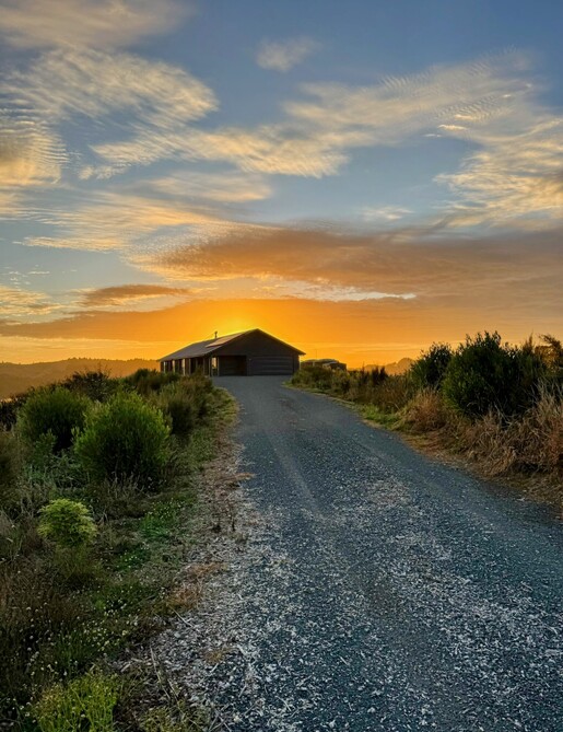 Image of dark exterior cladded new build home with Waikato rural outlooks. Built by Otorohanga builders, Coull Builders.