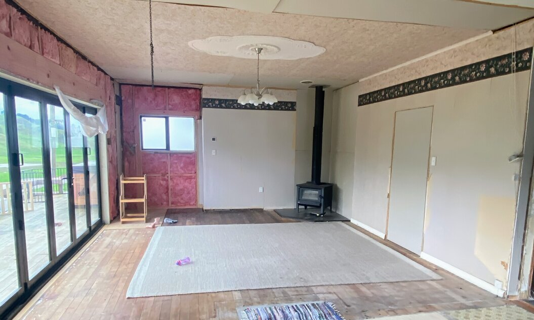 Image of stripped out lounge mid renovation, by Coull Builders.