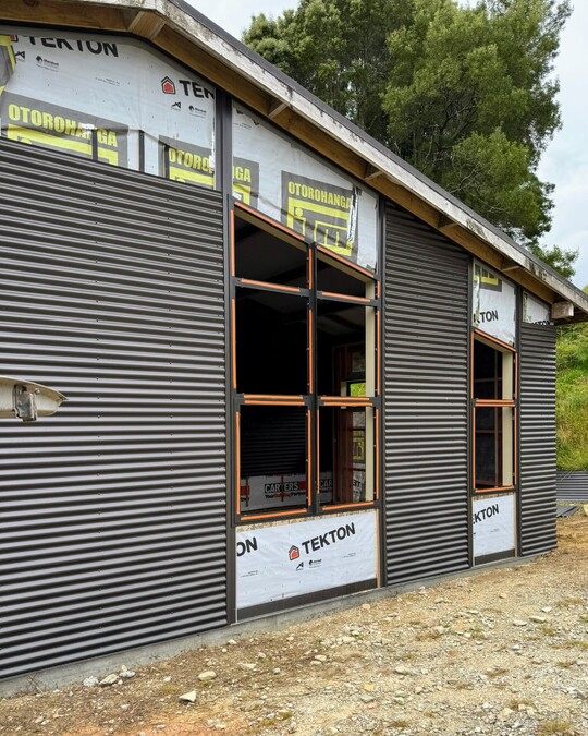 Dark exterior cladded office space in Waitomo by Coull Builders