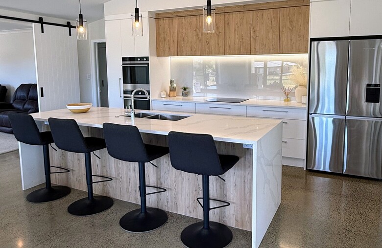 Image of light modern new kitchen with timber accents. New home built by Otorohanga builders Coull Builders.