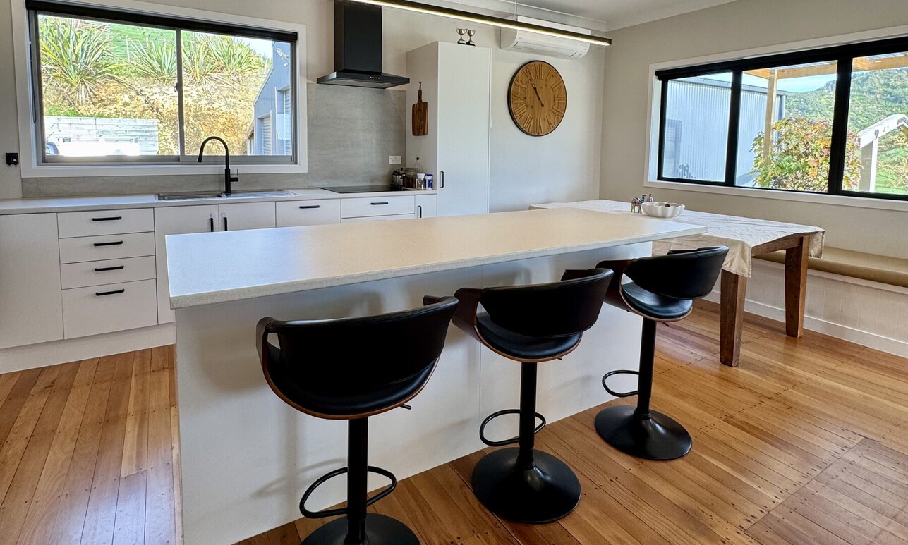 Light, airy and updated kitchen in a weatherboard home by Coull Builders, Otorohanga.