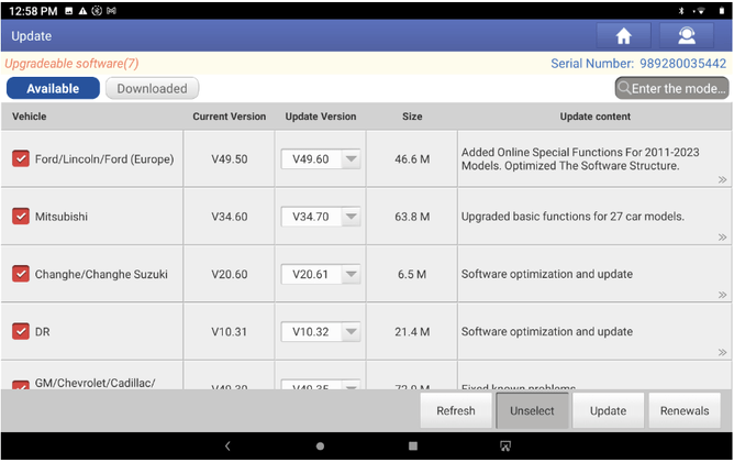 Technician performing vehicle diagnostics with updated scan tool
