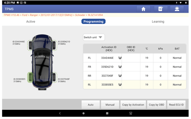 Launch TPMS wand being used to activate and program new tyre pressure sensors.