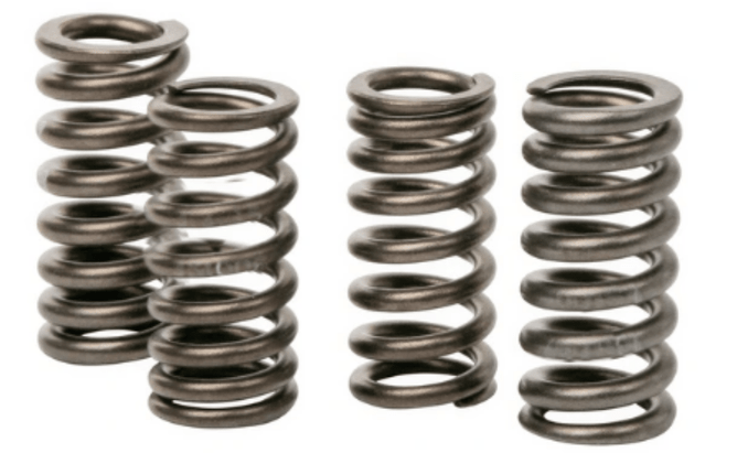 Technician replacing valve springs in Ford XR8 engine after diagnosing misfire