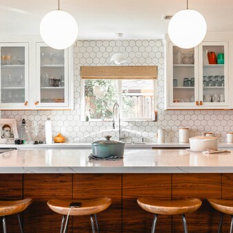 modern kitchen with cast iron casserole on bench