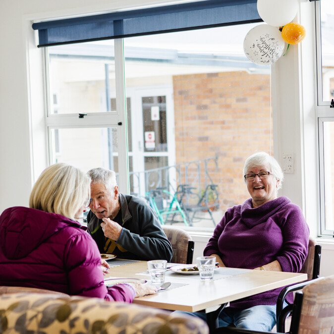 Residents enjoying a meal at Gymnasium at Assisi Residential Care