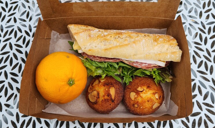 Our Take away option offering financiers, a filled roll and a piece of fruit