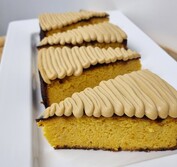 Soft orange cake topped with white chocolate and espresso ganache.