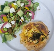 Our savoury quiche. Side salad dressed with a balsamic vinaigrette.  
