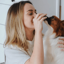 Image of cute dog with woman to showcase Critter Care's dog visit services. Waikato, New Zealand.