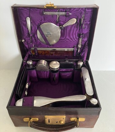 George V leather vanity case with sterling silver vanity set