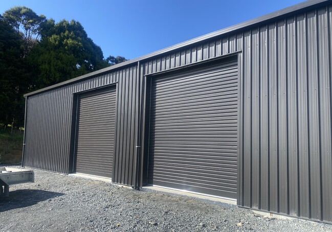Photo of industrial roller doors installed by Dominator Rodney for farm shed in Warkworth/Mahurangi area