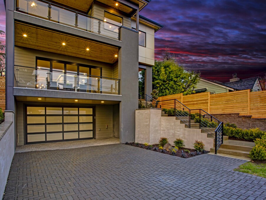 Photo taken at dusk showing a sectional garage door fitted with VL designer panels.