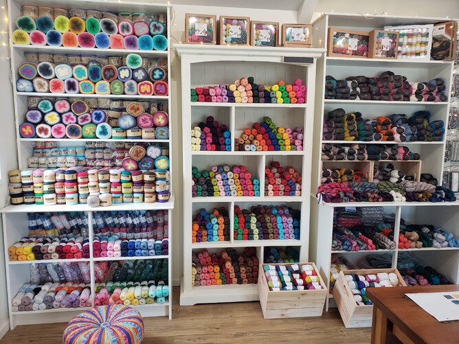 A large display of Scheepjes Whirls, Woolly Whirls, Whirlettes and Organicon. Second display has Scheepjes Catona and Schachenmayr kits. Third display has Kits, Rowan Kidsilk Haze, Malabrigo Mohair, West Yorkshire Spinners Exquisite Lace, Malabrigo Mohair, Scheepjes Alpaca Rhythm and Mohair Rhythm.