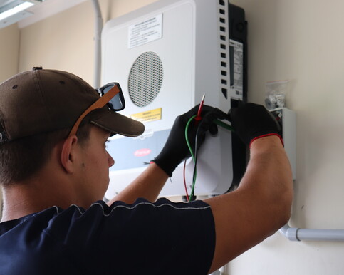 Northstar technician working on electrical box