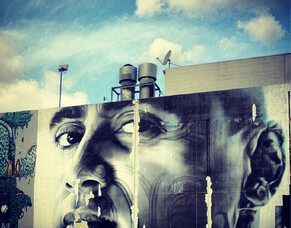 One Year On: Big Street Art Paste-Up of Tiki Taane with Moko in Newmarket