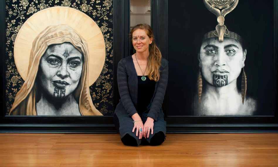 Artist Sofia Minson with her paintings "Rose of the Cross" and "Queen of Raa"